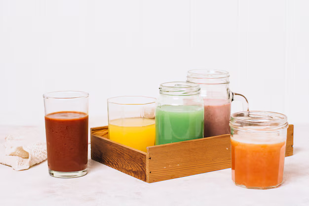 front-view-arrangement-colorful-smoothies_23-2148226127