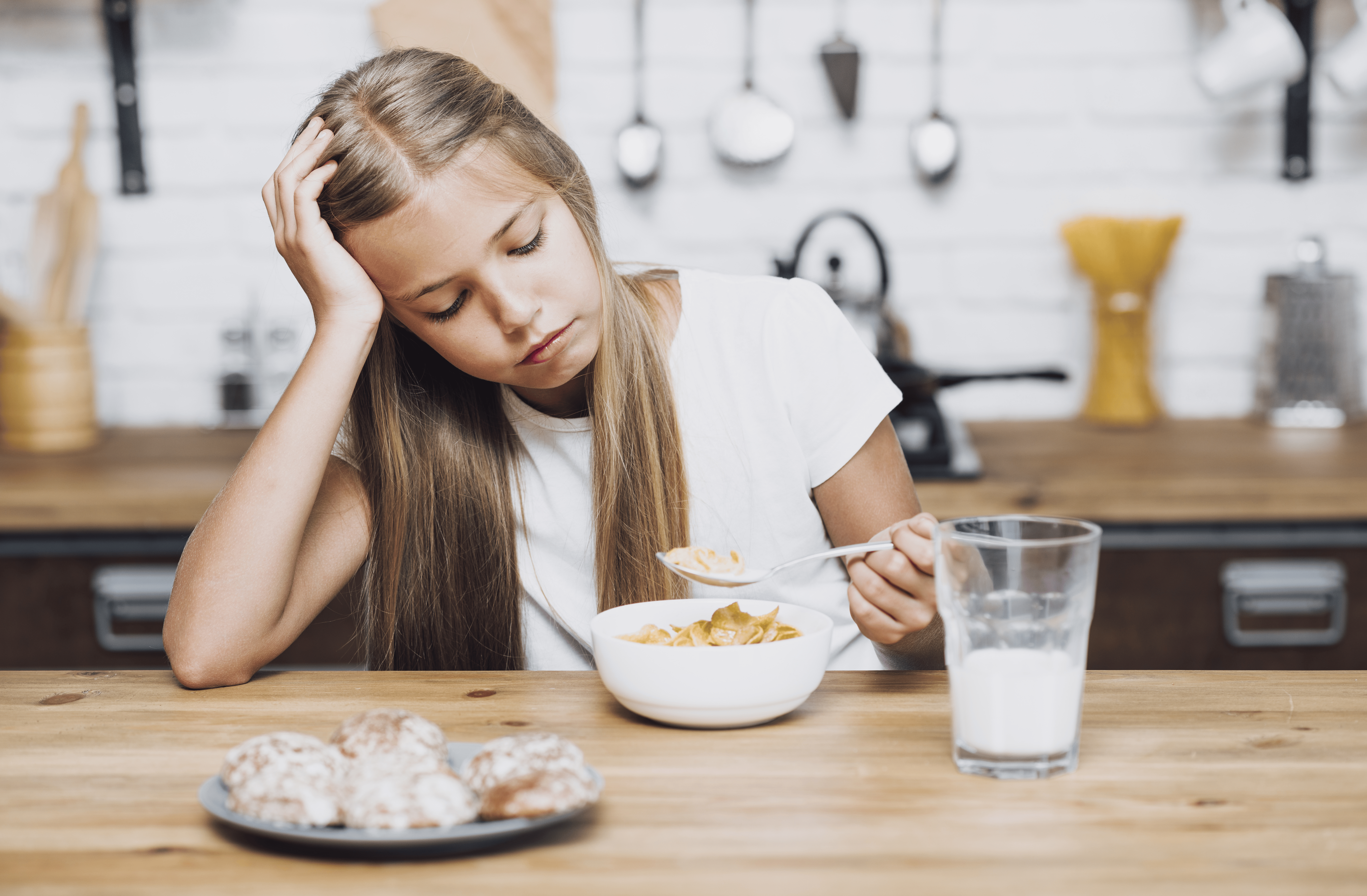 front-view-little-girl-looking-her-bowl-with-cereal