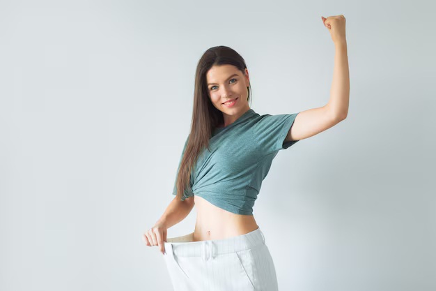 glad-thin-young-woman-is-satisfied-with-her-figure_90756-608