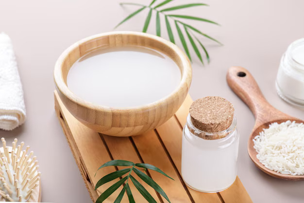 homemade-cosmetic-rice-water-with-ingredients-beige-background_92695-3005