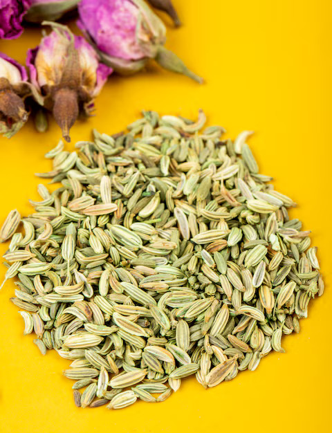 side-view-heap-dried-anise-seeds-with-tea-rose-buds-yellow-background_141793-8020