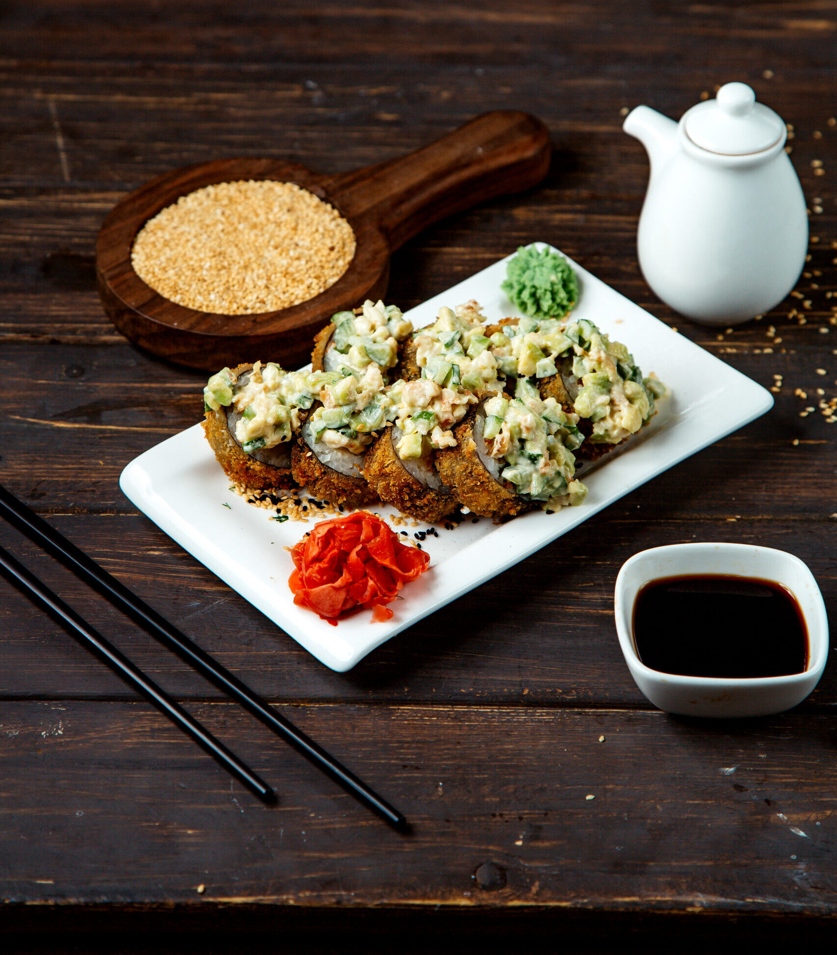 sushi rolls topped with salad
