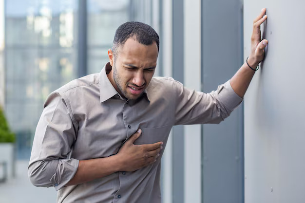 worried-young-man-clutching-chest-pain-suffering-from-heart-attack-health-emergency-concept_321831-23160